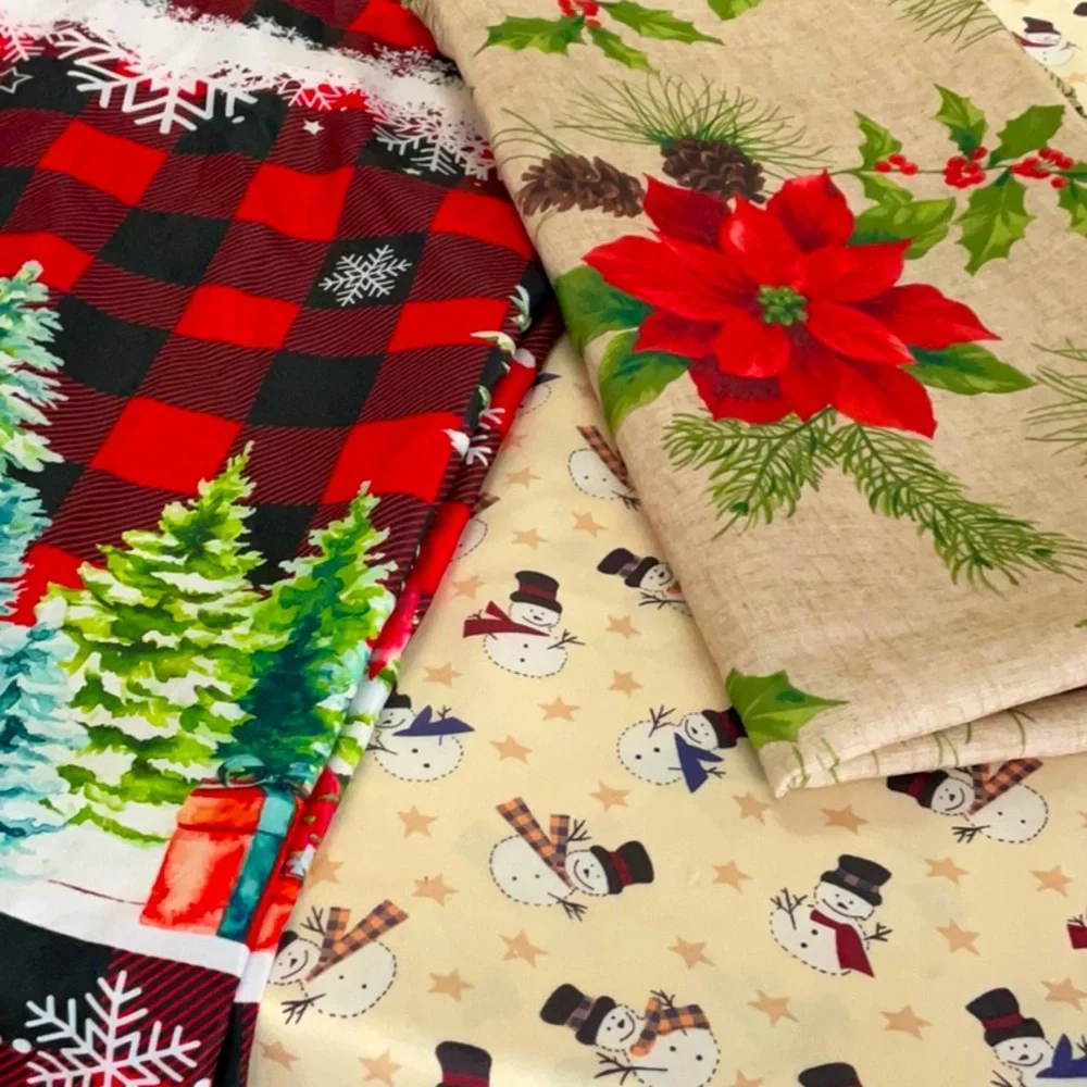 Three Christmas holiday tablecloths